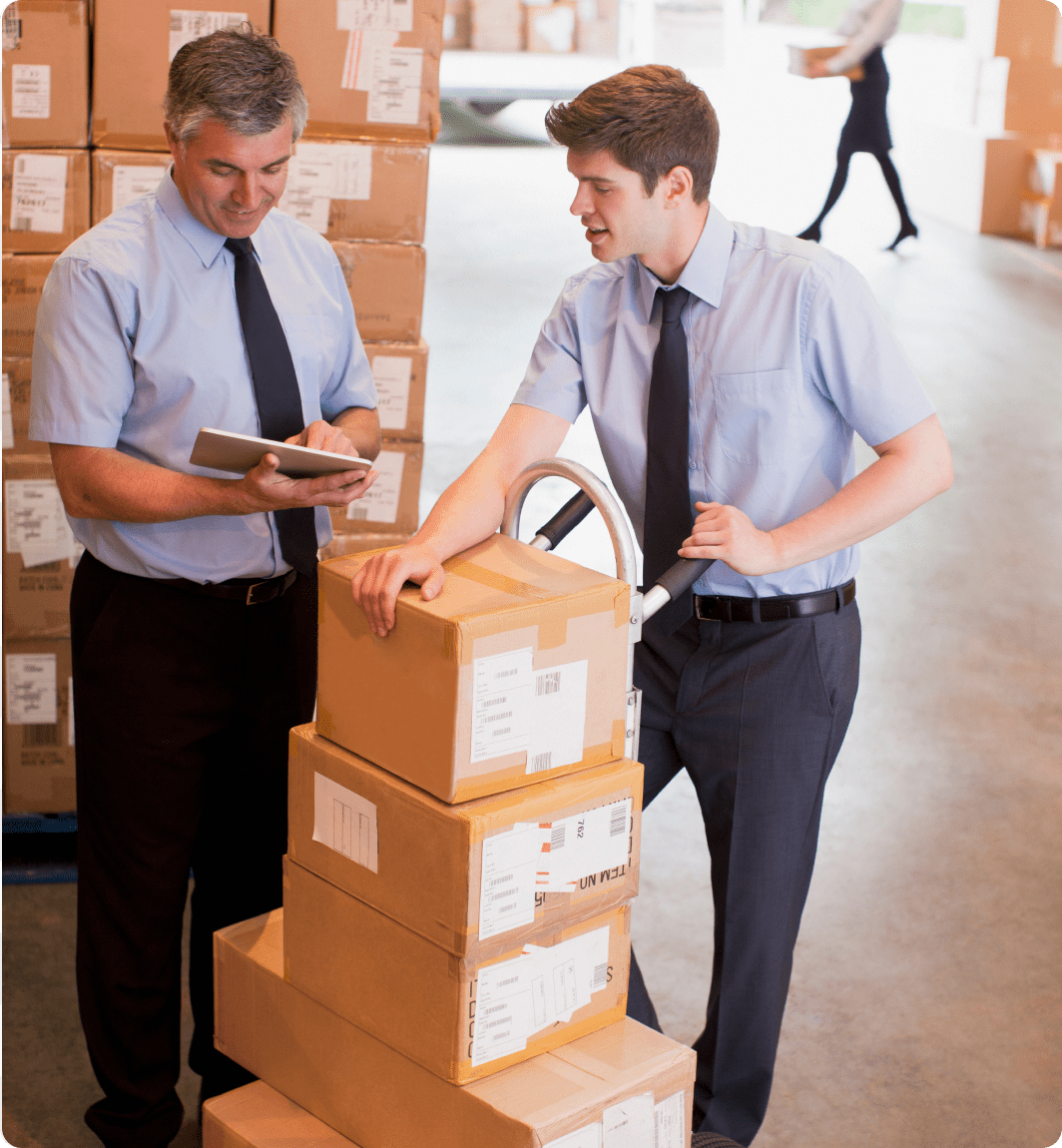Colleagues discussing logistics in warehouse