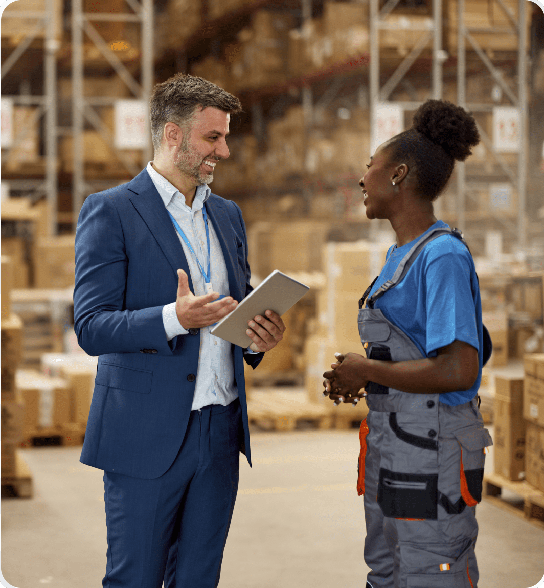 Warehouse meeting between manager and worker