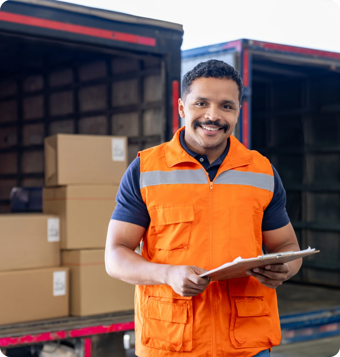 Warehouse employee checking inventory boxes